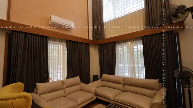 Living room with tall windows, home in Aluva